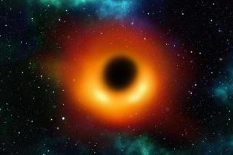 天文学家在早期宇宙中探测到一个极红的超大质量黑洞，在阴影中生长
